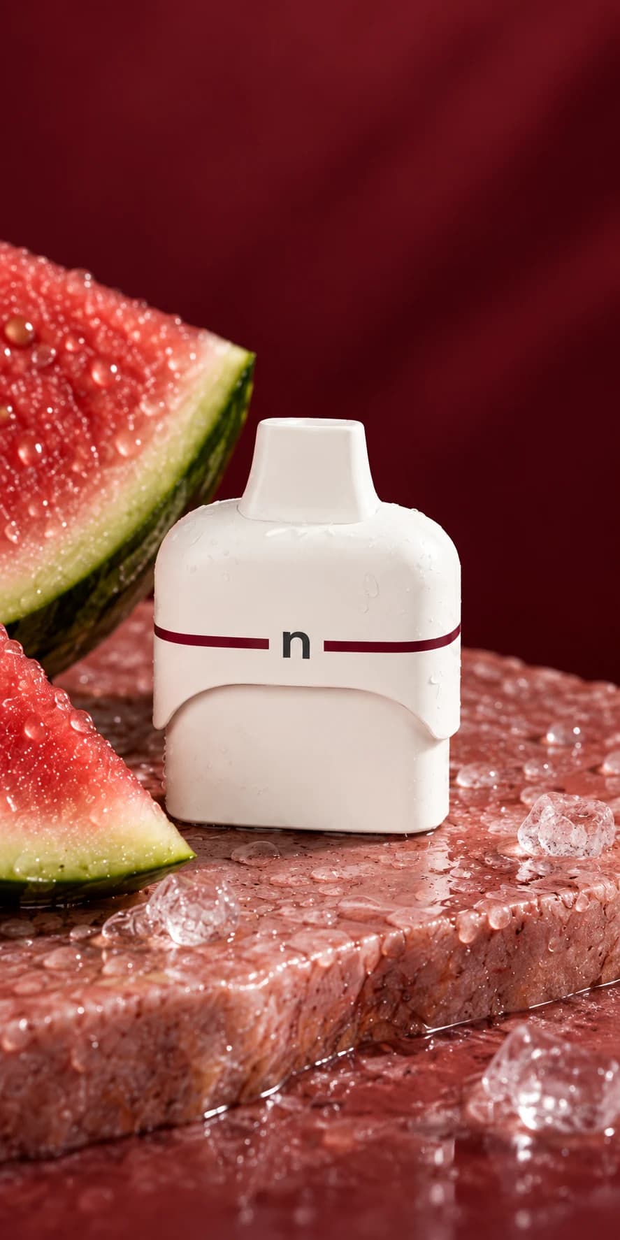 Watermelon Ice replacement pod photographed with watermelon and ice on rose stone